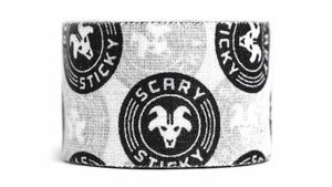 White and black Scary Sticky Goat Tape roll close-up