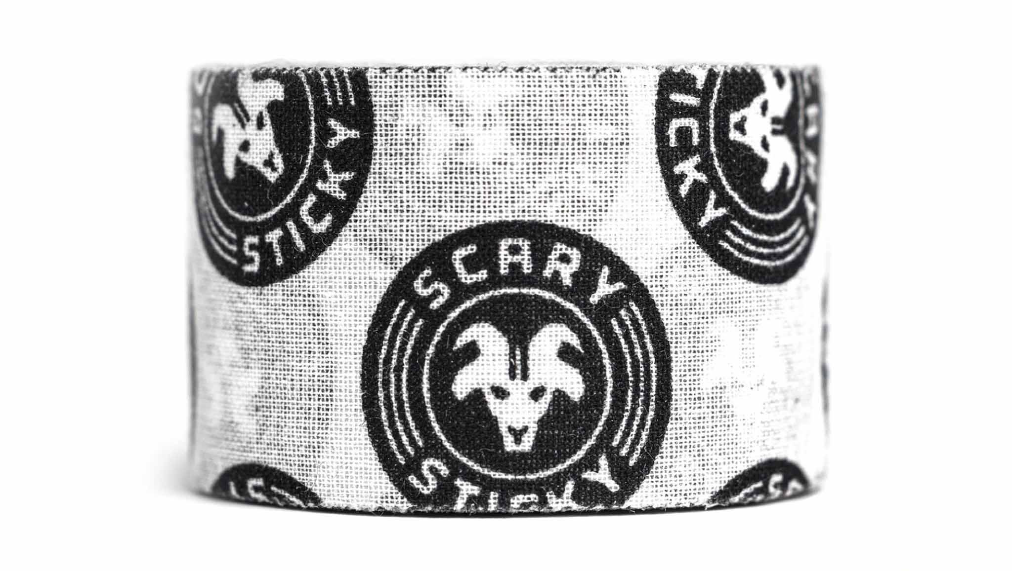 White and black Scary Sticky Goat Tape roll close-up