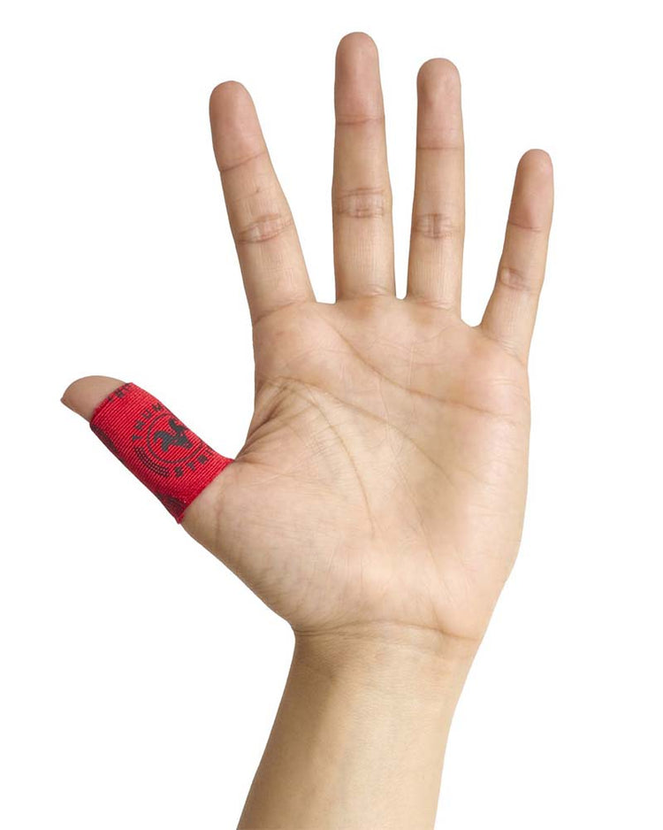 Hand with a red bandage on the thumb against a white background